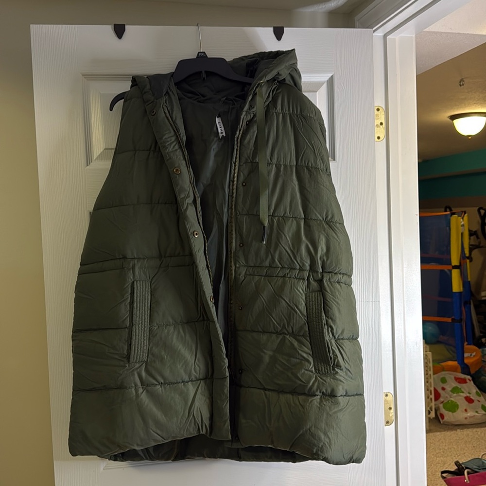 Green used vest in good overall condition